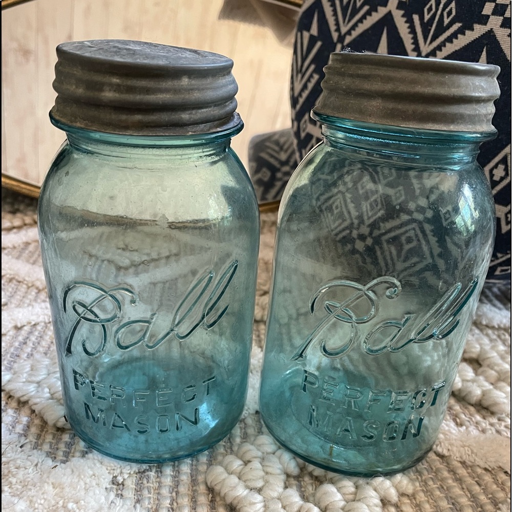A pair of Vintage blue quart size “Ball mason Jars” with zinc lids